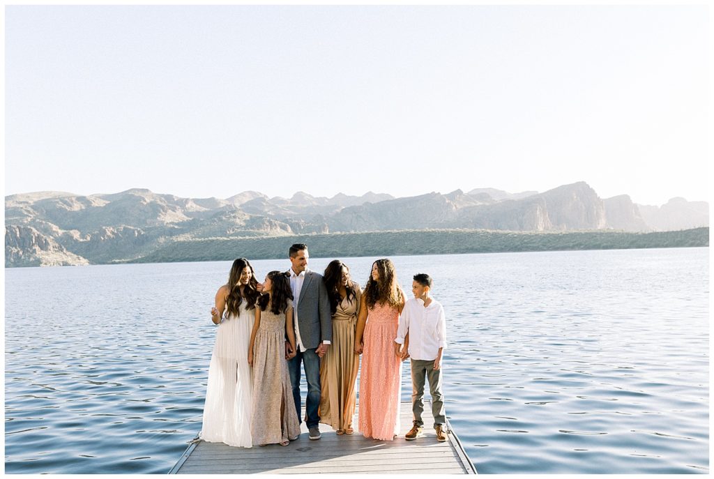 family photo shoot by the lake , neutral color tones for outfits