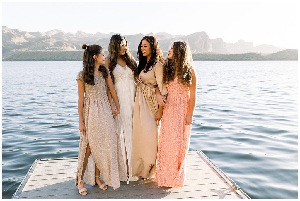 family photos in arizona by the lake with neutral color tones and flowy dresses