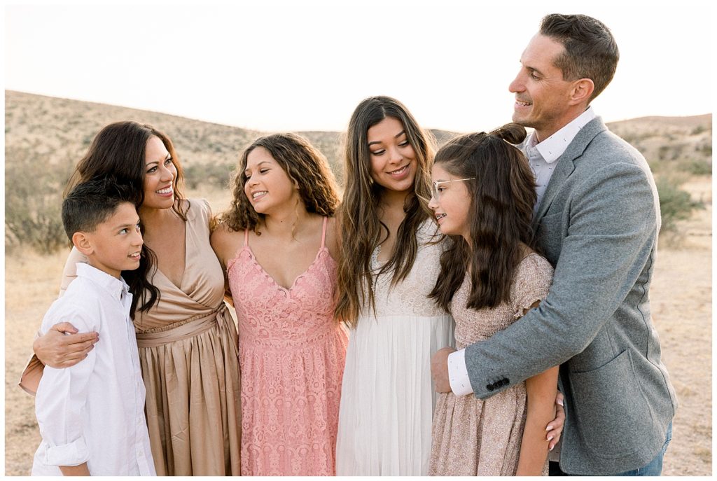 Family photoshoot with large families and neutral color palettes