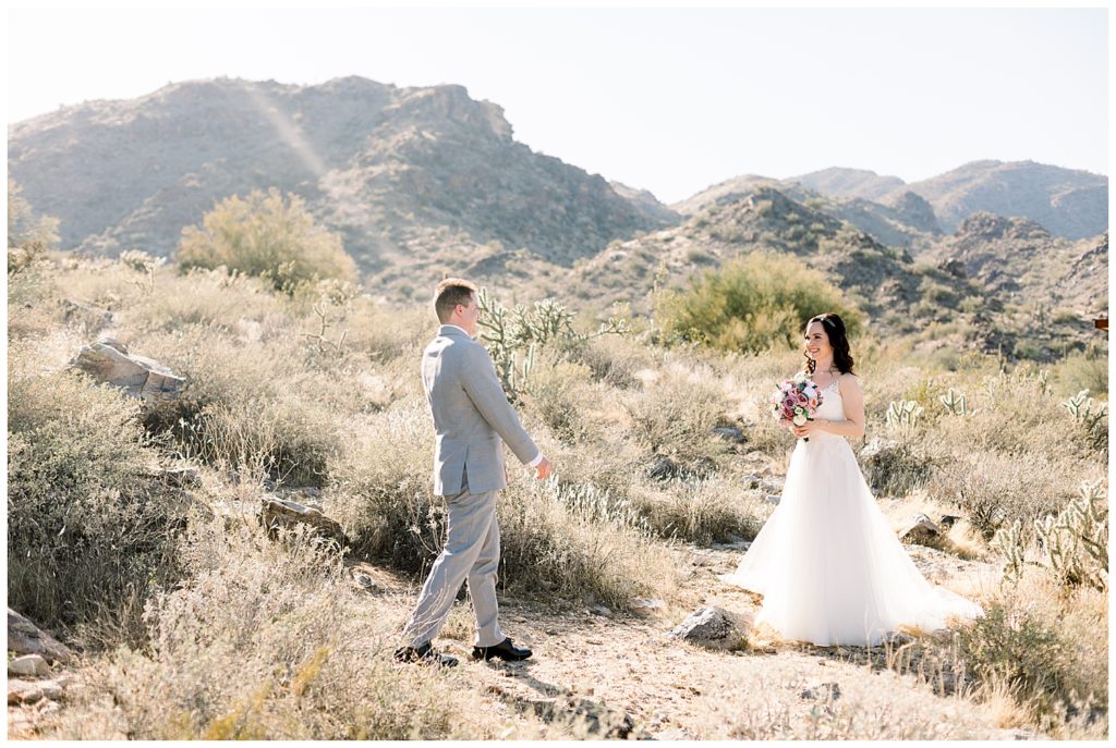 bride and groom first look in the desert for arizona elopement